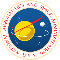 A blue sphere with stars, a yellow planet with a white moon; a red chevron representing wings, and an orbiting spacecraft; surrounded by a white border with "NATIONAL AERONAUTICS AND SPACE ADMINISTRATION U.S.A." in red letters