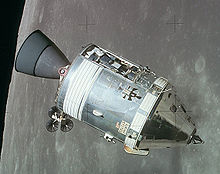 The cone-shaped command module, attached to the cylindrical service module, orbits the Moon with a panel removed, exposing the scientific instrument module